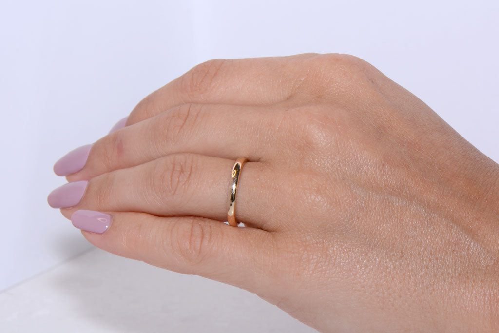 A Twentieth Century 18ct Gold wedding band