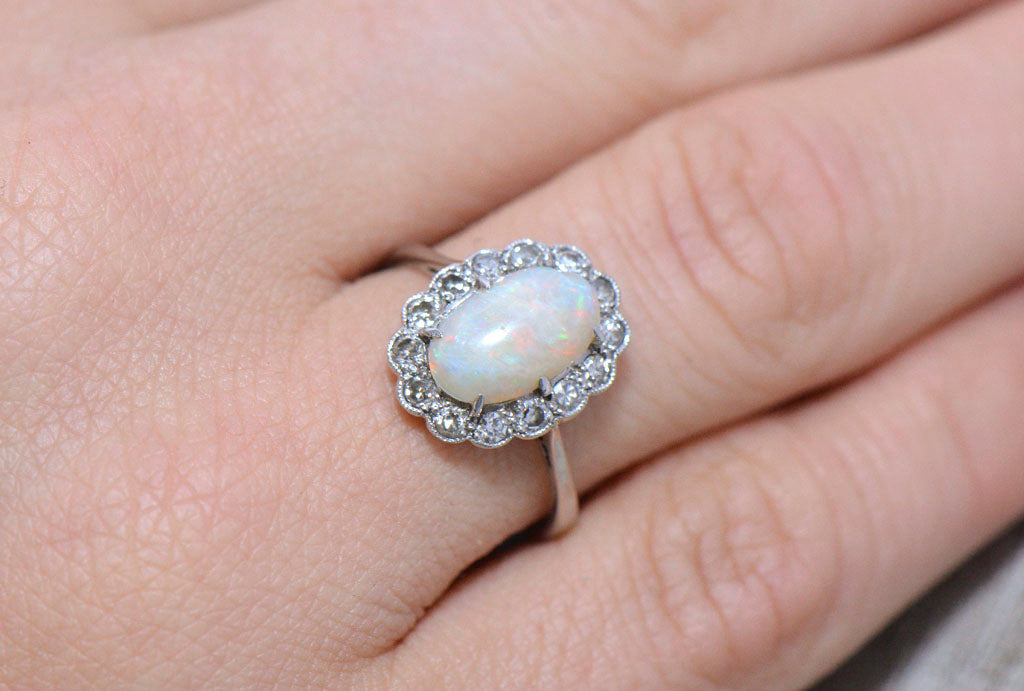 Antique opal, diamond, and emerald cluster ring